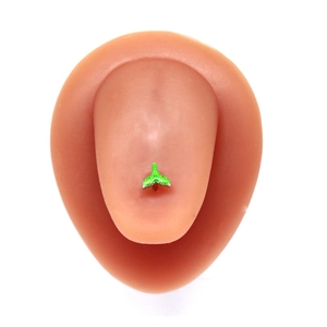 Detail of a green fish tail pattern tongue ring displayed on a realistic tongue model