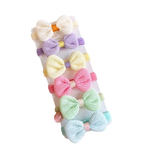 6-piece colorful bow hair ties set for kids with soft elastic towel rings on display card