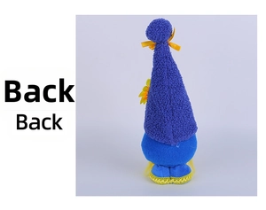Back view of plush sunflower gnome featuring a purple pointed hat and blue fabric body