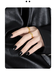 Detailed view of layered irregular gold wave rings with unique liquid metal lava texture