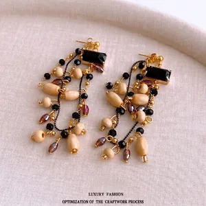 Vintage bohemian drop earrings with square glass, wood beads and gold metal tassels