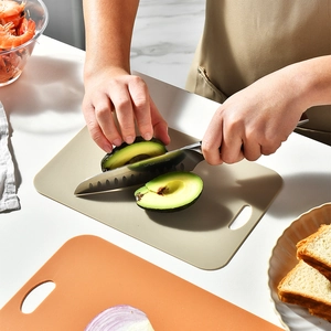 Lightweight 3-piece non-slip cutting board set in beige and orange for kitchen use