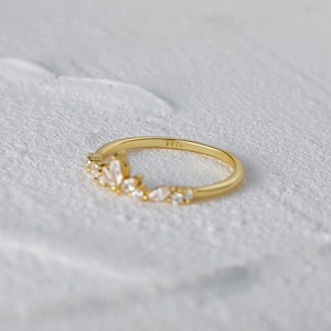 Macro shot of S925 silver stamp and marquise cut zircon stones on the gold floral ring