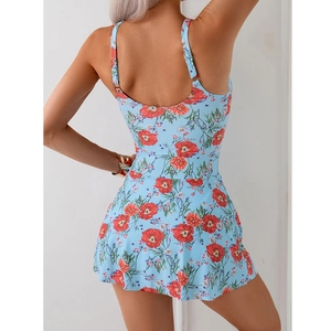 Rear view of light blue swim dress featuring red floral print and thin straps detail