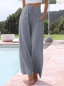 Relaxed fit grey linen wide leg trousers with drawstring waist for summer vacation wear