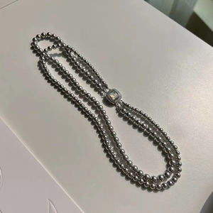 Double-layered gray glass pearl necklace with a square pavé-set mother-of-pearl clasp