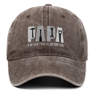 Detail of PAPA tools embroidery on a vintage washed brown cotton baseball cap