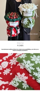 Macro texture of red and green lamb wool gift wrap with white snowflake patterns
