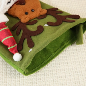 Creative Christmas reindeer stocking gift bag with forest green and red knit textures