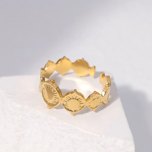 Golden stainless steel sun medal ring with vintage textured relief on stone base