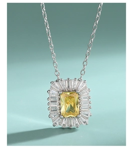 Macro shot of S925 sterling silver necklace with rectangular yellow diamond pendant
