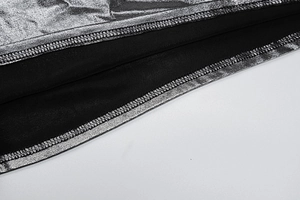 Detailed macro view showing the silver metallic coating and black lining stitching