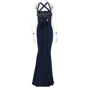 Detail of navy blue fishtail evening dress with backless criss-cross strap design