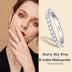 Close-up of S925 sterling silver stamp and D color moissanite pave setting on ring band