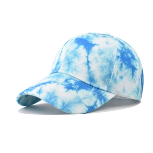 Detail of blue and white tie-dye gradient cotton baseball cap with breathable eyelets