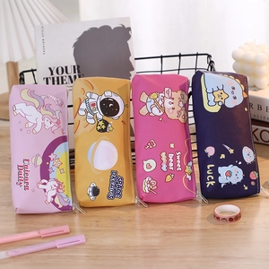 Close-up of cute cartoon pencil cases in unicorn, astronaut, bear, and dinosaur patterns