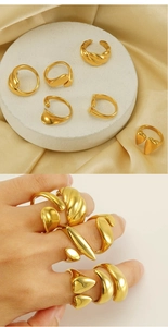 Detailed view of 6-piece gold geometric ring set with polished 18k mirror finish