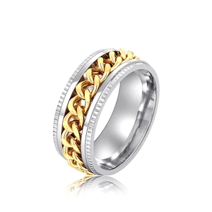 Macro detail of rotating curb chain inlay and textured edges on two-tone punk ring