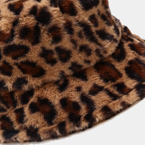 Detailed close-up of fluffy leopard print faux fur texture on a winter bucket hat