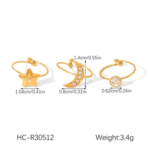 Detailed view of gold star, moon and zircon ring set with precise size measurements