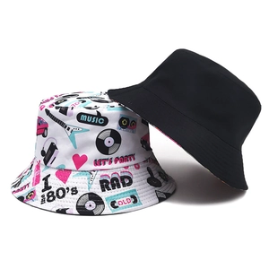 Reversible bucket hat with 80s nostalgic cassette and music print on white and plain black