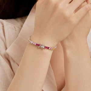 Detail view of a S925 sterling silver bracelet with multi-colored heart-shaped zircon stones