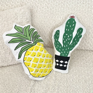 Creative cartoon pineapple and cactus shaped decorative throw pillows on white sofa
