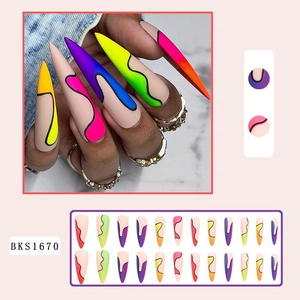Detail of long stiletto press-on nails with neon gradient waves and pop art patterns