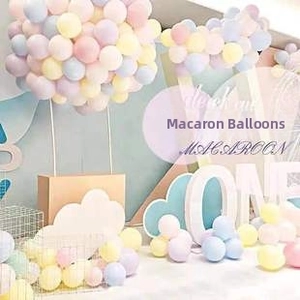 Macro view of pastel macaroon balloon set with cloud props for party stage decoration