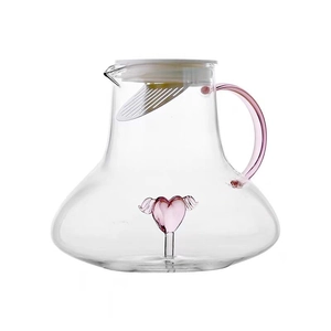 Borosilicate glass pitcher with pink heart design and filter lid on white background