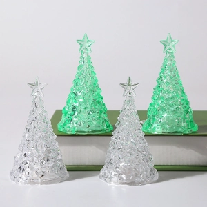 Set of four glowing acrylic Christmas tree desktop lamps with crystal texture and star top