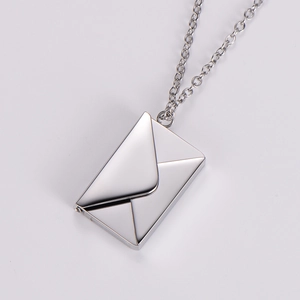 Detailed close-up of a silver stainless steel magnetic envelope pendant and thin link chain