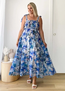 Detail of the smocked bodice and adjustable straps on this blue floral summer maxi dress