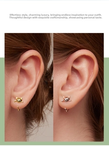 Detailed close-up of cute cat-shaped ear studs in gold and rose gold finishes