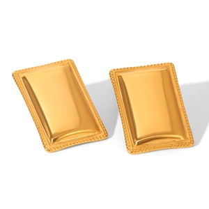 Close-up of golden rectangular 18K gold-plated steel earrings with beaded edge detail