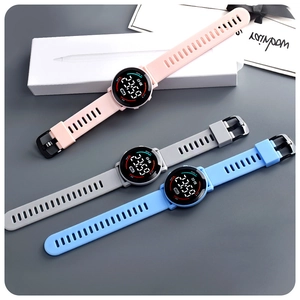 Close-up of LED digital sport watches with silicone straps in pink, grey, and blue colors
