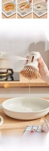 Detail view of soap dispensing dish brush with transparent liquid reservoir window