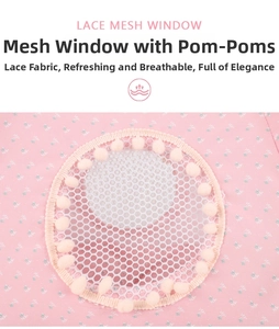 Lace mesh window detail of pink floral pet tent with decorative soft plush balls