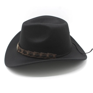 Detail of a black Western cowboy felt hat featuring a braided brown band and vintage buckle