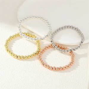 Minimalist elastic beaded rings in polished gold silver rose gold and gunmetal finish