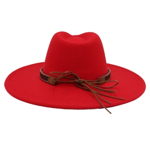 Detail of red wool felt fedora with 9.5cm wide brim and brown leather bow ribbon