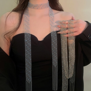 Detailed macro view of luxurious mesh choker necklace with crystal tassels and navy beads