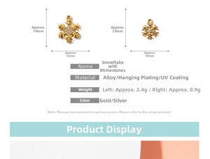 Detail view of snowflake charms in gold alloy with crystal accents and dimensions