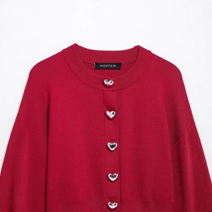 Red knit cardigan for women featuring silver heart-shaped buttons and a classic round neck
