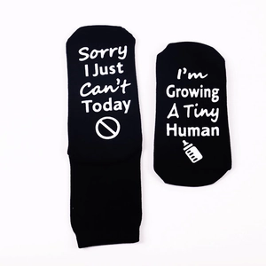Funny black novelty socks with Sorry I Just Can't Today text and non-slip bottom