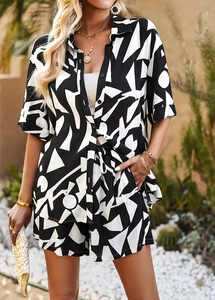 Detailed close-up of women's two-piece set featuring black and white geometric patterns