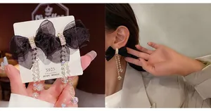 Detail of S925 silver fringe earrings with mesh bow and crystal beads on a model