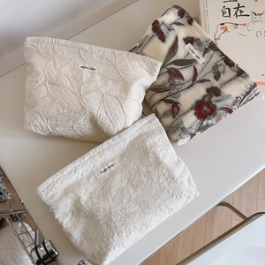Minimalist embroidered floral handbags in white cotton linen fabric with artistic books