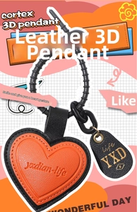 Detailed macro of orange heart leather pendant with black stitching and yxdian-life engraving