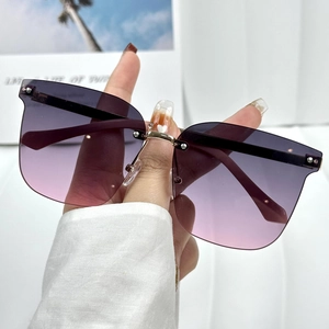 Fashionable rimless oversized sunglasses with purple gradient lenses and gold metal stems